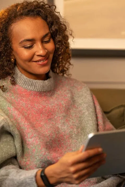 JamStorage customer checking her stored items in the online inventory on a tablet